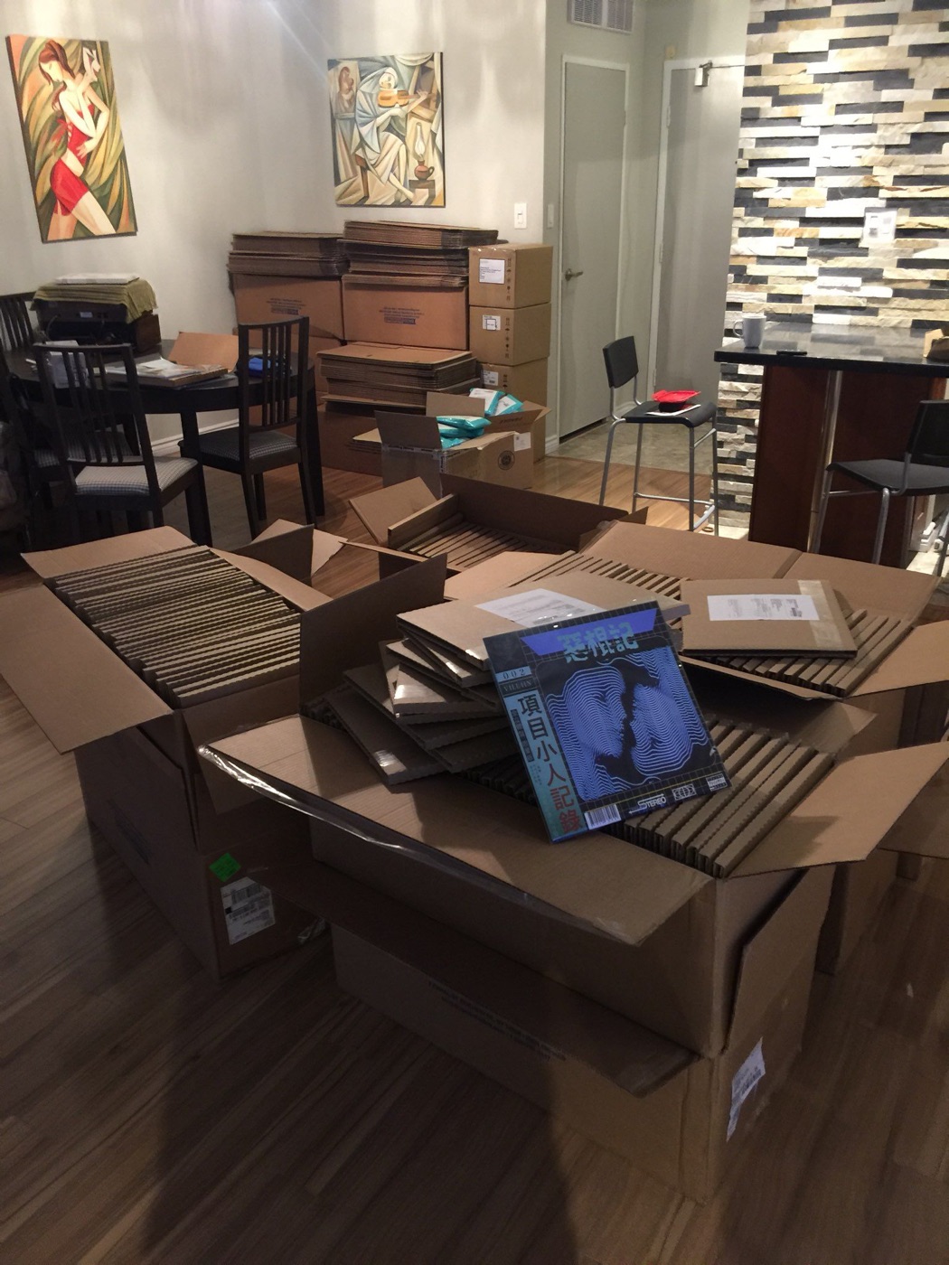 Boxes of MTHRBORD vinyl being packed for shipping